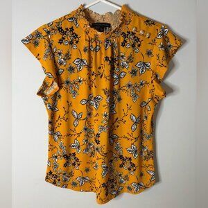 Adrienne Vittadini Gold Ruffled Blouse with Black and White Floral Design